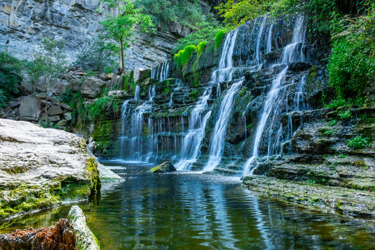 A beautiful waterfall amongst rocks. Nature background.