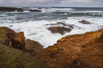 Waves breaking on California coastline 