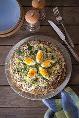 Layered liver cake with cheese, mayonnaise and dill. Savory cake. Overhead vertical photo
