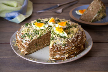 Layered liver cake with cheese, mayonnaise and dill. Savory cake. horizontal photo