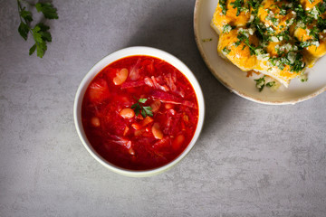 Soup made with vegetables, meat, bean and beet root: borsht, bortsch, borshch, borscht. Traditional dish in Ukraine, Russia, Poland. View from above, top studio shot