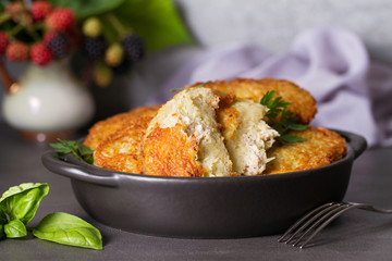 Potato Cakes with beef meat filling. Vegetable fritters, latkes, draniki. Vegetable pancakes