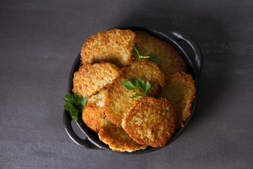 Potato Cakes. Vegetable fritters, latkes, draniki. Vegetable pancakes. View from above, top studio shot