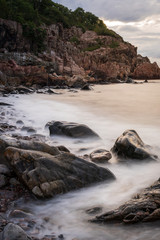 Rocky beach during sunset at Kullaberg in Sweden.