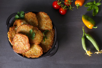 Potato Cakes. Vegetable fritters, latkes, draniki. Vegetable pancakes. View from above, top studio shot