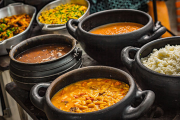 Clay pots with Brazilian foods