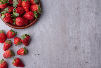 Top view of a plate full of strawberries with room for text