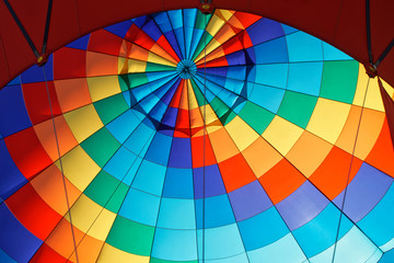 Obraz premium The inner surface of a festive multicolor balloon. Rainbow colors and pride flag. Diversity and freedom, relaxation and travel