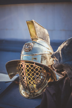 Vertical Shot Of A Gladiator Helmet And Cloack In A Roman Reenactment Event In Seville, Spain