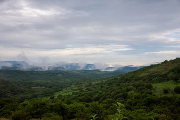 cloudy landscape of a green valley