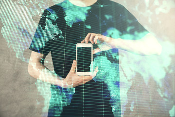 Double exposure of man's hands holding and using a phone and international business theme drawing.