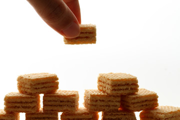 A wafer is a crisp, often sweet, very thin, flat, light and dry biscuit