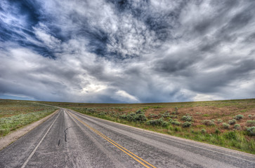 Fototapeta na wymiar Into the endless. A road in Utah leads us wherever...