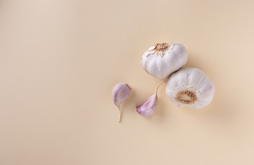 garlic cloves on a beige background