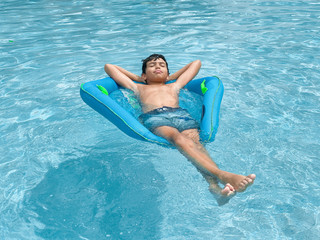 family brothers relaxing by the pool in Naples Florida stock photo royalty free 