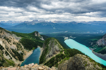 Obraz premium Moody panoramic view showing Lake Louise and Lake Agnes in Banff National Park, Alberta, Canada.