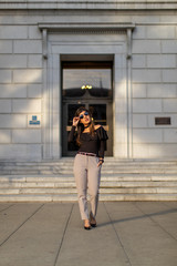 young woman in front of a building