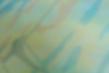 Abstract in soft shades of blue, green and light red