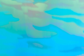 Abstract in soft shades of blue, green and light red