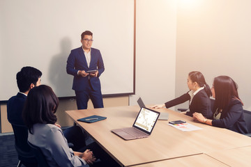 Business people  in seminar room. Meeting Corporate Success Brainstorming Teamwork