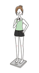 体重計にのる女性