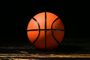 Ball for playing basketball on dark background