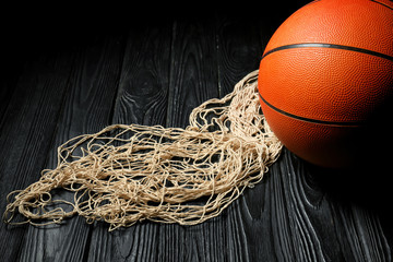 Ball for playing basketball and net on table