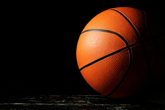 Ball for playing basketball on dark background