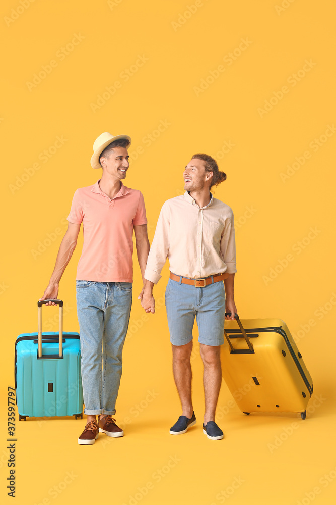 Sticker Couple of gay tourists on color background