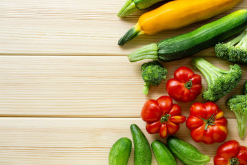 Set of various vegetables on a light wooden background. Space for text