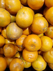 Closeup of Fresh ripe oranges for sale on a market in Thailand.