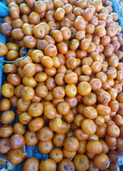 Closeup of Fresh ripe oranges for sale on a market in Thailand.