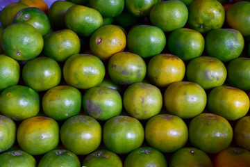 Closeup of Fresh ripe oranges for sale on a market in Thailand.