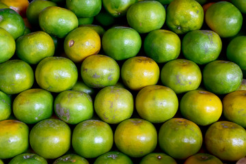 Closeup of Fresh ripe oranges for sale on a market in Thailand.