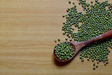 Closeup of Fresh Mung Beans in a wooden spoon isolated on the white background, Full depth of field.