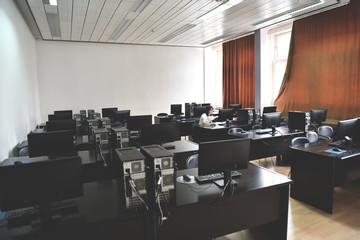 one student in computers classroom