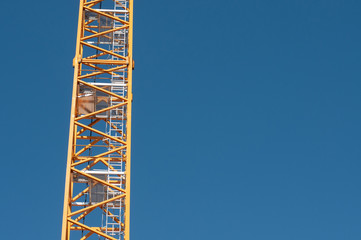 the latticed boom of a construction crane