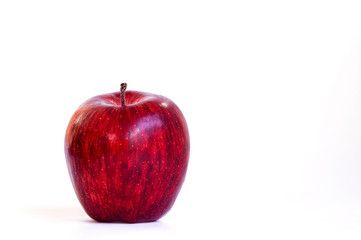One red apple on a white background, Ripe red apples are isolated on a white background and leaves space for the product's ad text. Red apple fruit isolated on the white background with clipping path.
