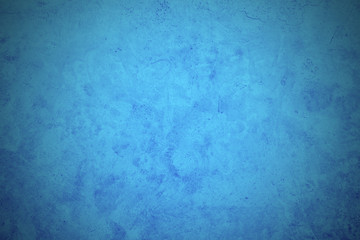abstract blue background texture vintage, Old blue smooth plaster wall with crack for background, Old blue wall, vignette, slightly brighten the center of the image for filling letters.