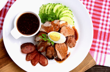 Barbecued red pork in sauce with rice..Thai Pork Menu.