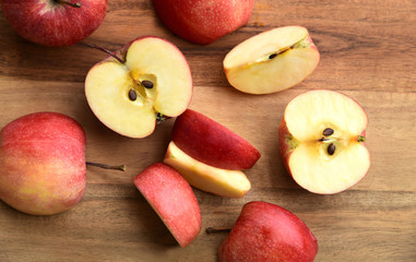 Top view a lot of  fresh Gala red apple isolated on wooden background