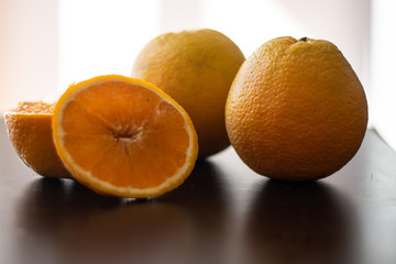 Fresh orange on the table. Healthy fruit for breakfast