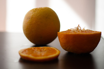 Fresh orange on the table. Healthy fruit for breakfast