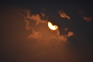 sun behind the clouds Sunset