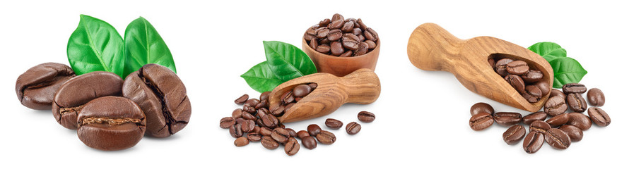 Heap of roasted coffee beans with leaves isolated on white background . Set or collection