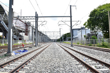 Fototapeta premium Trains running on the train tracks to the station in Thailand. Select focus with shallow depth of field.
