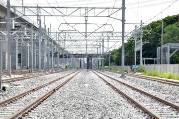 Fototapeta premium New Railroad tracks let the train run through with nature background, Selective focus with shallow depth of field.