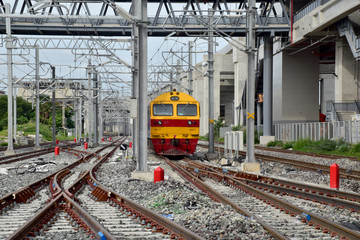 Trains running on the train tracks to the station in Thailand. Select focus with shallow depth of field.