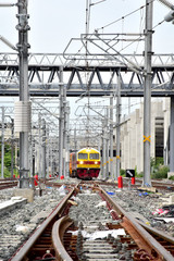 Trains running on the train tracks to the station in Thailand. Select focus with shallow depth of field.