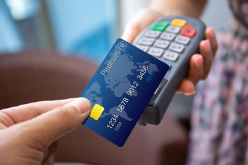 woman man hands holding plastic card pay pass online terminal